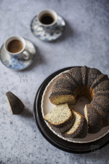 Sliced lime poppy seed cake with coffee