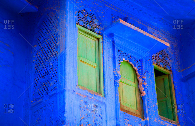 Close up of windows on blue buildings in Jodhpur, India
