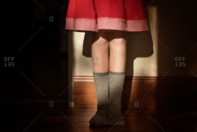 Girl in a skirt and wool socks