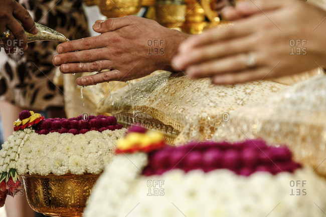 Hands being rinsed during wedding