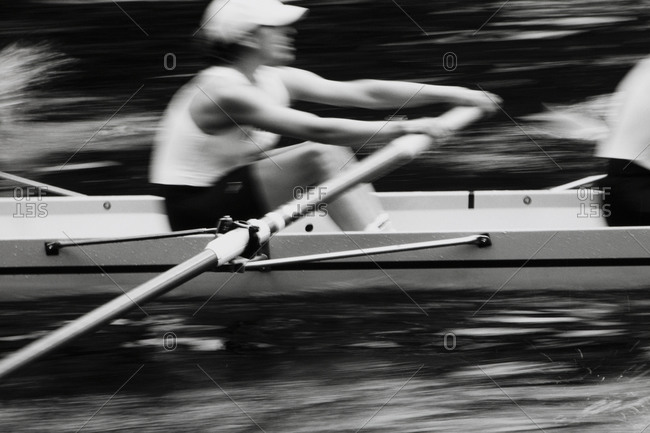 Women\'s crew team rowing a scull boat during competition