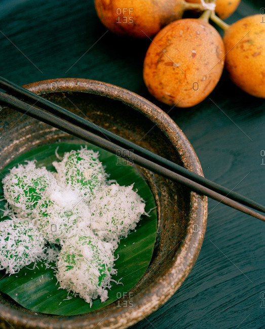 Sweet coconut covered rice balls in bowl, Bali
