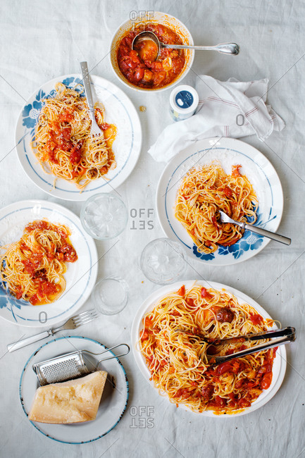 Blue floral plates filled with spaghetti and tomato sauce