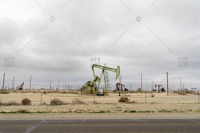Oil pumps in desert landscape