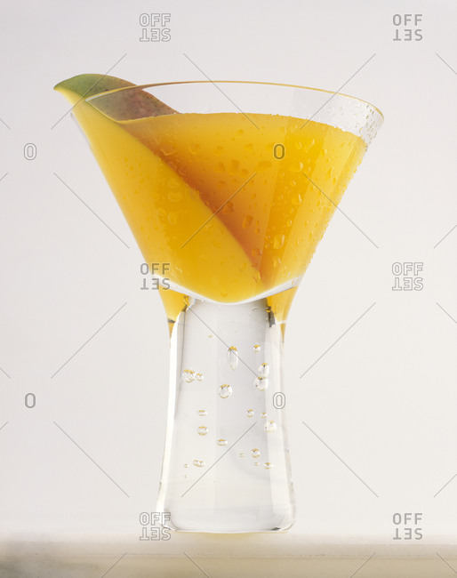 Mango sapphire martini in a glass