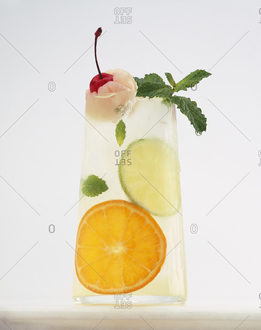 Lychee cooler with cherry, citrus, and mint