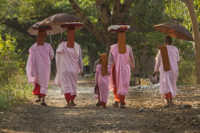 Buddhist nuns walking down road, Myanmar, Mandalay