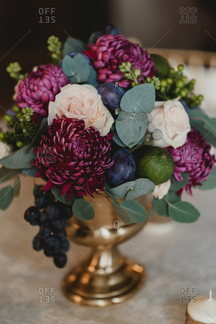 Close up of purple and white floral arrangement at a wedding
