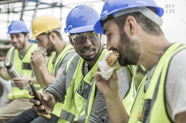 Construction workers having lunch break on construction site
