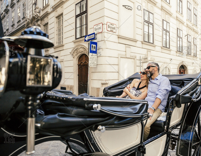 Couple in love on sightseeing tour in a fiaker, Vienna