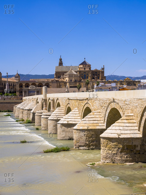 Puente Romano over Rio Guadalquivir with Mezquita-Catedral in background, Cordoba, Spain