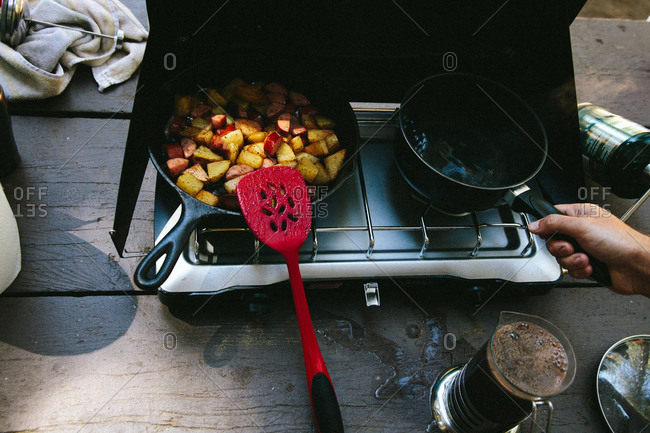 Cooking breakfast on a camp stove