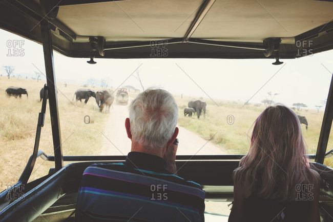 Older man and girl touring rural Africa