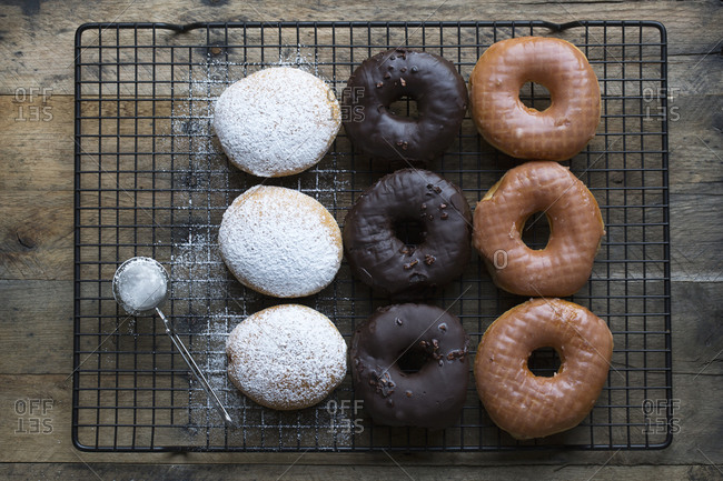 Three types of donuts on a wire baking rack