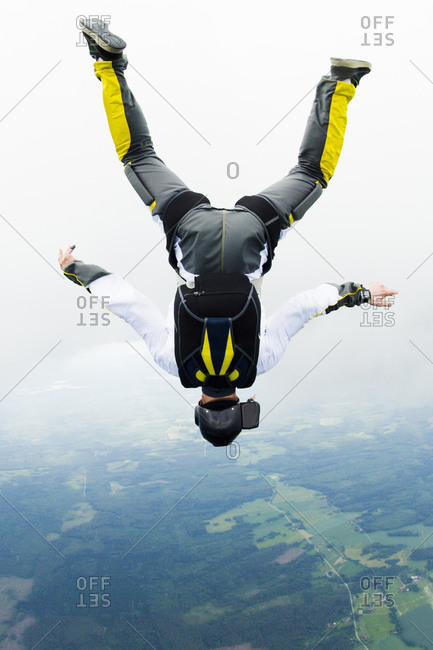 Parachute jumper flipped upside down in the sky