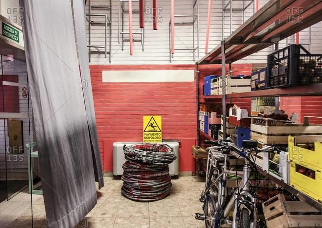 Bicycle and crates of produce in a restaurant stockroom