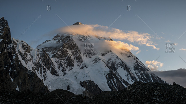 K2 mountain peak and clouds at sunrise