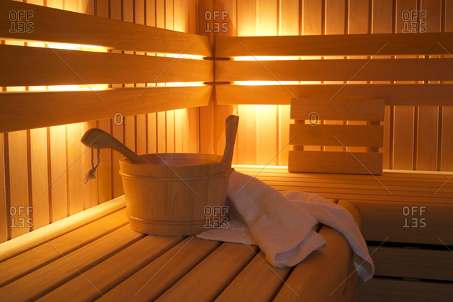 Bucket and towels in sauna