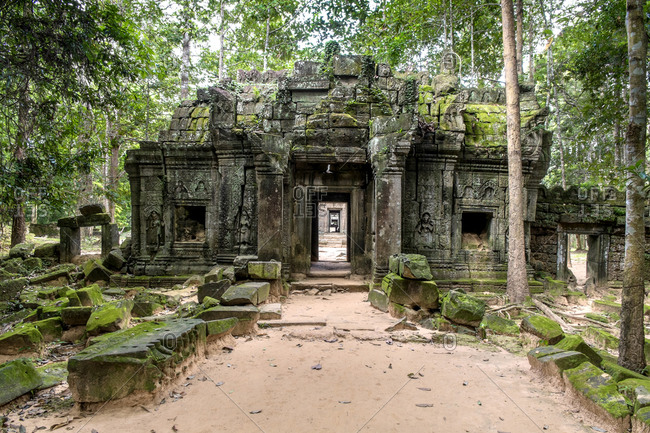 Ancient stone temple and mossy stone walkway, Phumi Ta Saom, Siem Reap, Cambodia