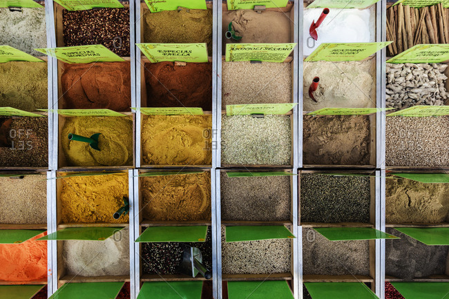 Overhead view of bins of spices in market