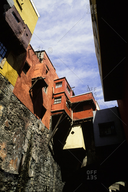 Buildings on top of a stone wall in Guanajuato, Mexico