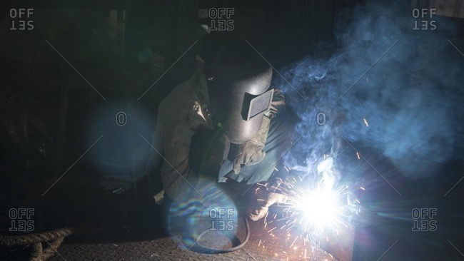 Welder in a plant, India