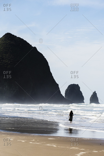 Woman on the beach, Haystack Rock, Cannon Beach, Oregon