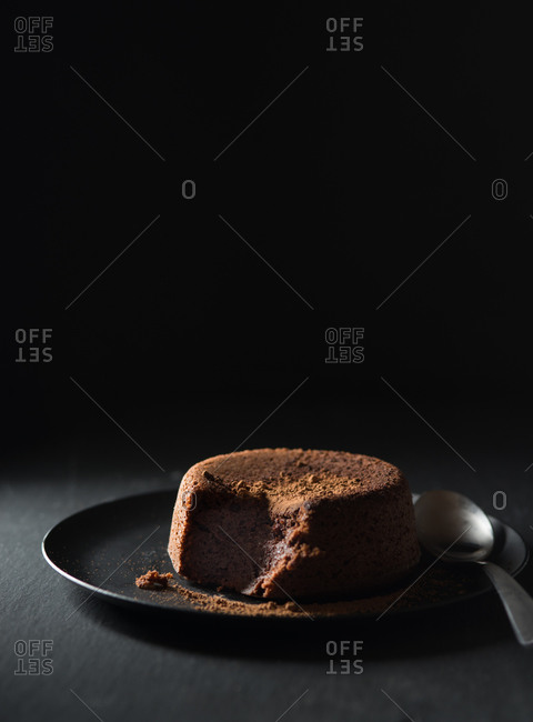 Miniature chocolate cake with a missing bite