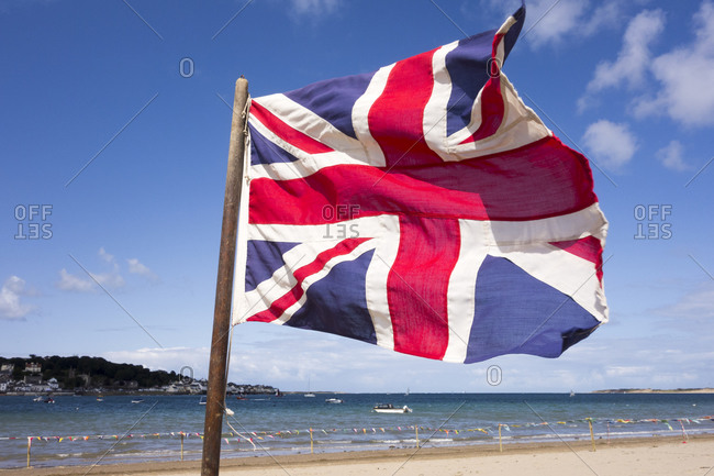 British flag flying on a beach in Devon, United Kingdom