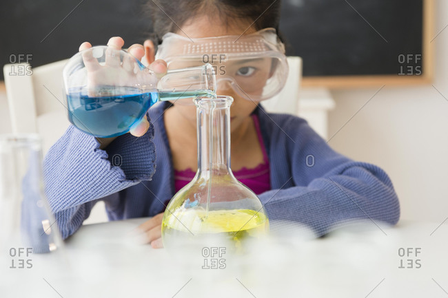 Student doing science experiment in classroom