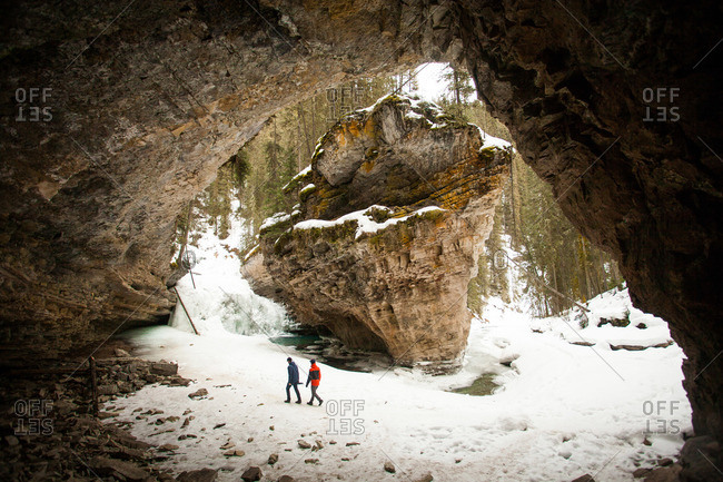People exploring winter rock formations