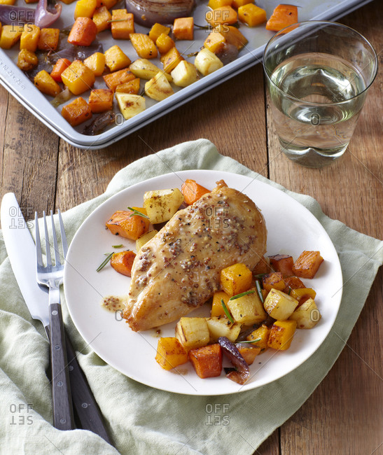 Chicken breast on a plate with roasted squash
