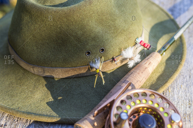 Fly fishing hat with flies and rod