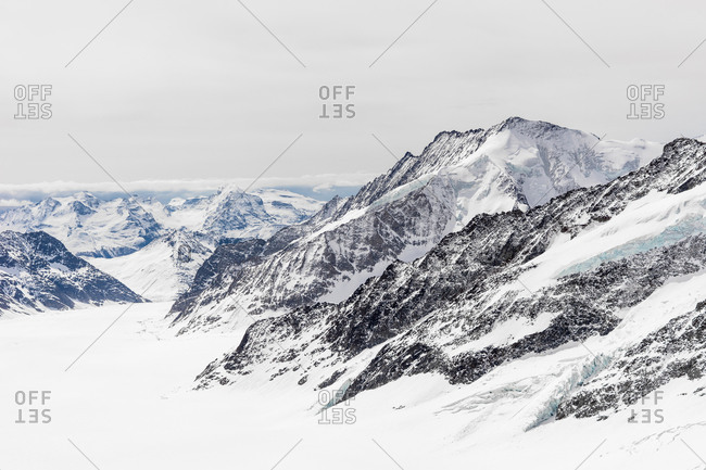 Snow blanketing the peaks of the Swiss Alps