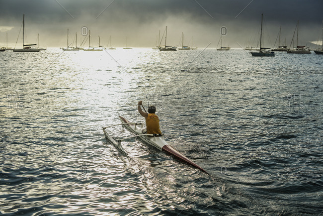 Man kayaking off the coast of Moorea, French Polynesia