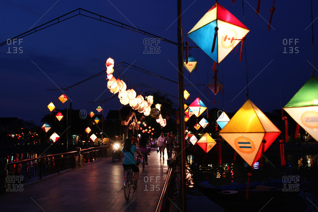 The lantern lit bridge at night time in Hoi An, Vietnam