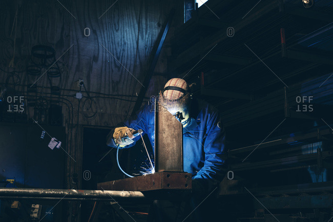 Man in welding mask at work