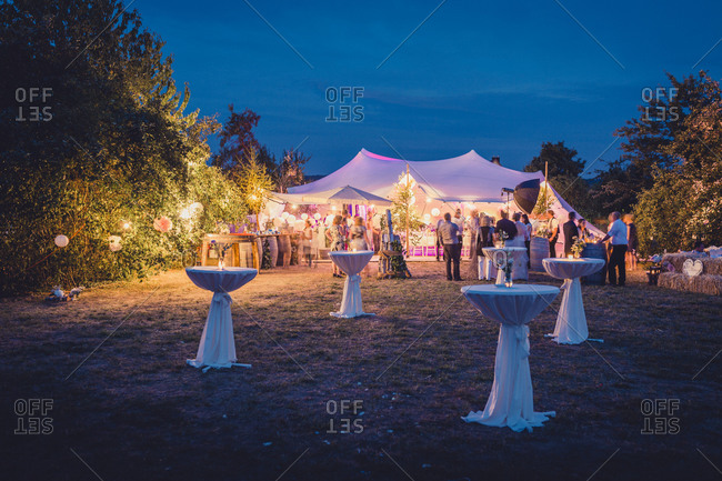 Tables on lawn by wedding reception