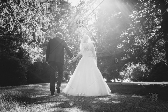 Bridal couple in sunny rural setting