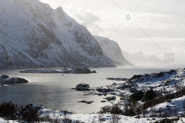 Snow covered mountains and fjord near Unstad, Lofoten Islands, Norway