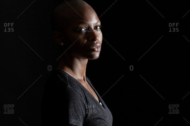 Profile of a young woman with a shaved head