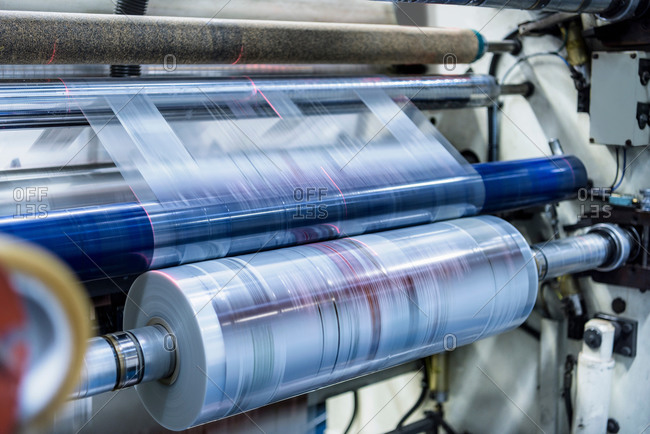 Printed plastic film in roll at a food packaging printing factory