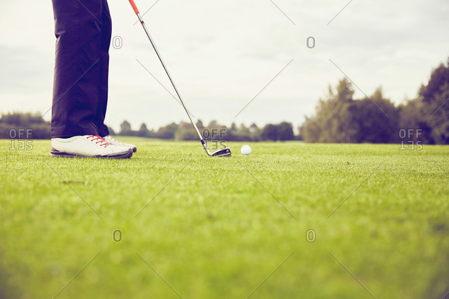 Low section of a golfer playing golf on course, Korschenbroich, Dusseldorf, Germany