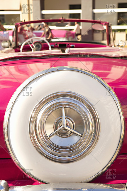 Rear end of a pink vintage car in Havana, Cuba
