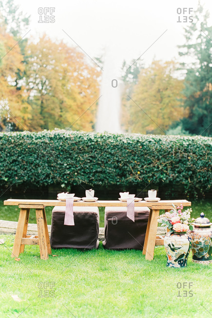 Asian-style sweetheart table set in garden