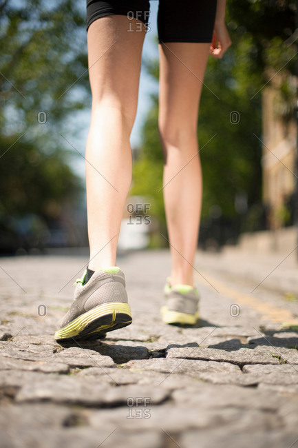 Runner on cobbled street