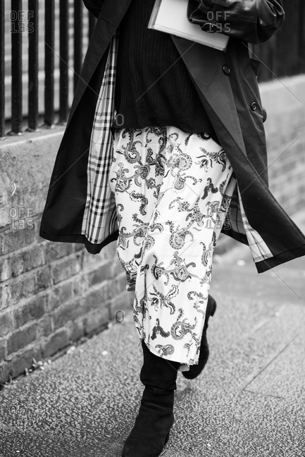 Woman walking in a printed skirt