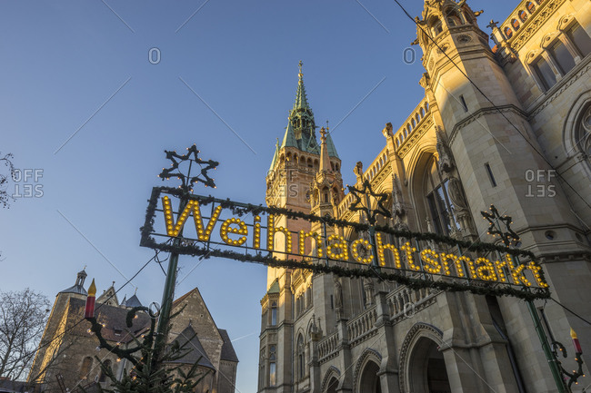 Germany, Braunschweig, Christmas market sign at townhall in the evening