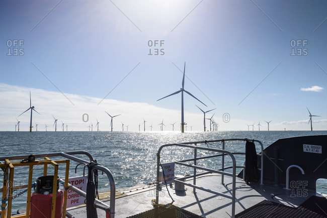 View of offshore windfarm from service boat in the water
