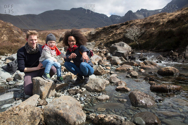Family by stream, Fairy Pools, Isle of Skye, Hebrides, Scotland